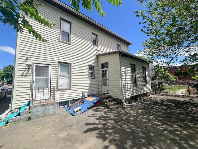 57 Milne St, Bridgeport, CT 06605 - rear view of house featuring entry steps