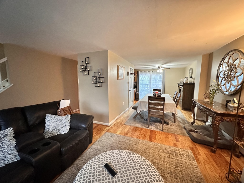 74 Churchill Dr Unit 74, Newington, CT 06111 - living room with light wood-style flooring and ceiling fan