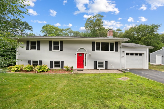 41 Laurel Leaf Dr, Ledyard, CT 06335 - bi-level home with driveway, an attached garage, a front yard, and a chimney