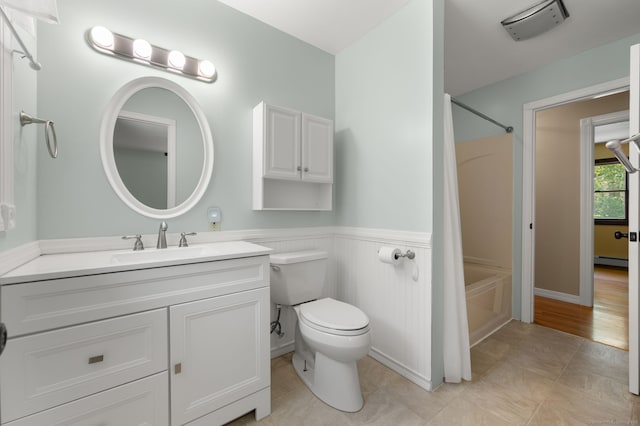 41 Laurel Leaf Dr, Ledyard, CT 06335 - bathroom with shower / washtub combination, vanity, baseboard heating, wainscoting, and tile patterned floors