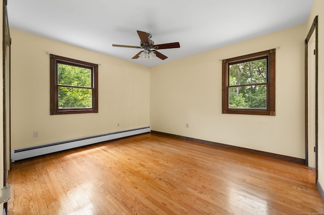 41 Laurel Leaf Dr, Ledyard, CT 06335 - unfurnished room featuring a baseboard radiator, light wood finished floors, and a ceiling fan