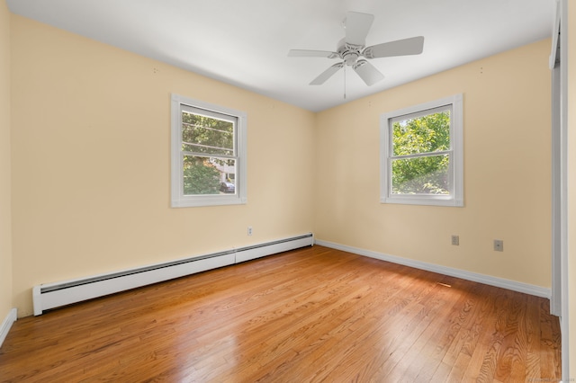 41 Laurel Leaf Dr, Ledyard, CT 06335 - unfurnished room with a baseboard heating unit, plenty of natural light, wood-type flooring, and ceiling fan