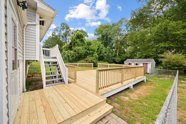 41 Laurel Leaf Dr, Ledyard, CT 06335 - wooden terrace featuring stairway, a shed, and view of wooded area