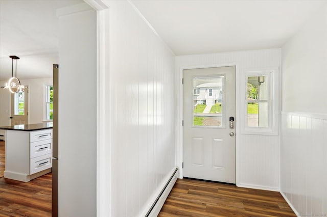 75 Atwood Hts, Thomaston, CT 06787 - doorway to outside with dark wood-style flooring, a baseboard radiator, and wainscoting