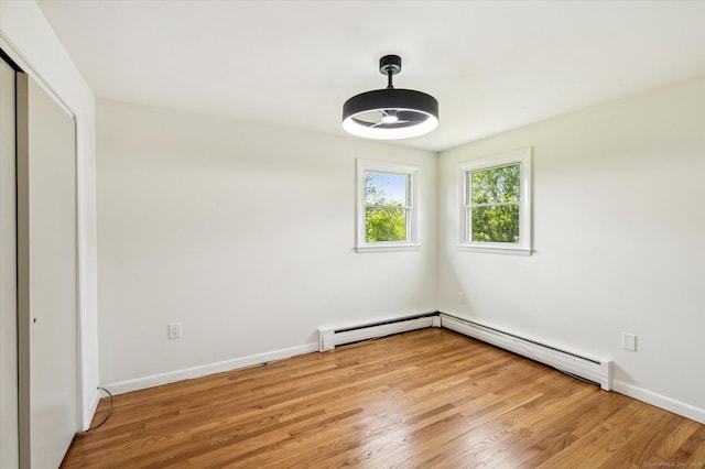 75 Atwood Hts, Thomaston, CT 06787 - unfurnished room with a baseboard radiator, a baseboard heating unit, and light wood-style flooring