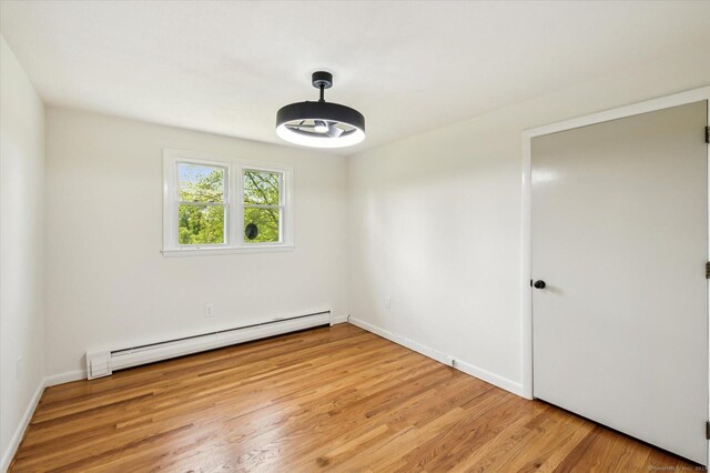 75 Atwood Hts, Thomaston, CT 06787 - unfurnished room with a baseboard radiator and wood finished floors