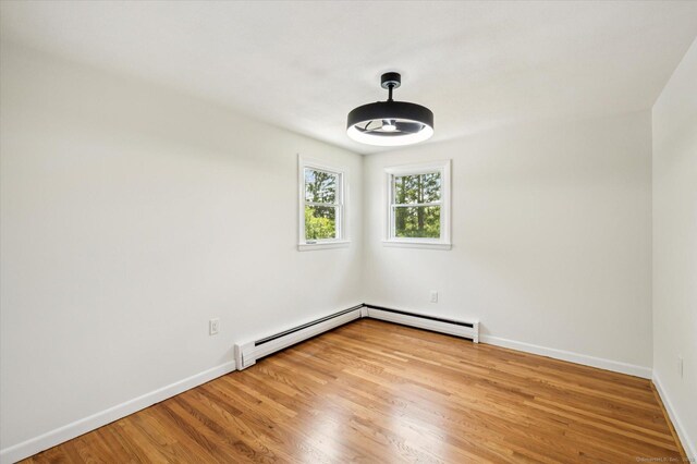 75 Atwood Hts, Thomaston, CT 06787 - unfurnished room featuring a baseboard radiator and wood finished floors
