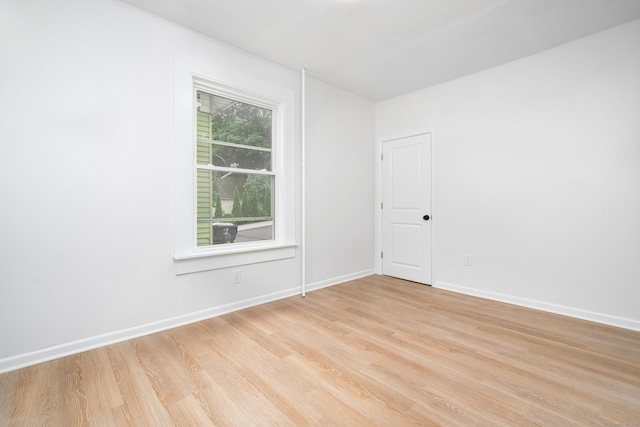 105 High St, Sprague, CT 06330 - empty room with light wood-style floors and baseboards