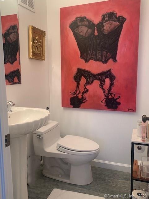 350 Grovers Ave Unit 11A, Bridgeport, CT 06605 - bathroom with toilet and baseboards