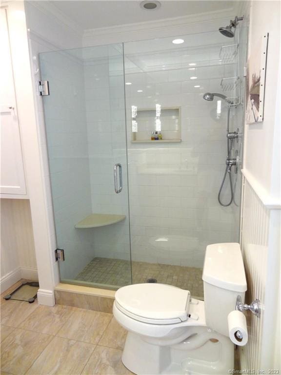 350 Grovers Ave Unit 11A, Bridgeport, CT 06605 - bathroom featuring crown molding, a shower stall, and tile patterned floors