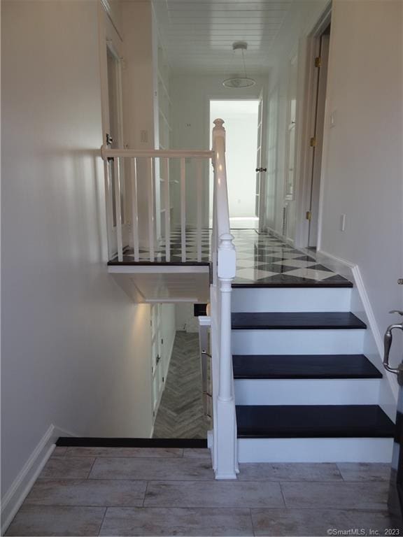 350 Grovers Ave Unit 11A, Bridgeport, CT 06605 - stairway with baseboards and wood finished floors