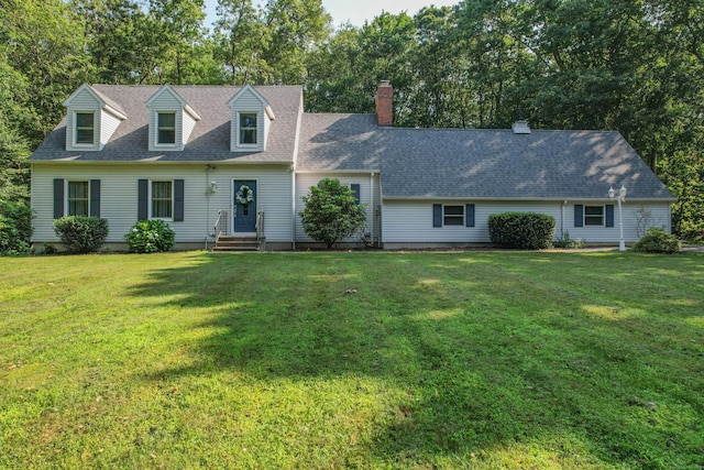 10 Heritage Dr, Prospect, CT 06712 - cape cod house with a front yard, a shingled roof, a chimney, and view of scattered trees