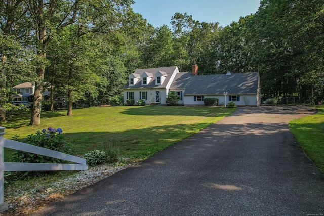 10 Heritage Dr, Prospect, CT 06712 - new england style home with asphalt driveway, a chimney, and a front lawn