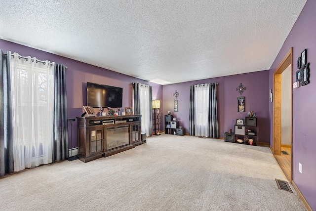 10 Heritage Dr, Prospect, CT 06712 - carpeted living room featuring a textured ceiling and a baseboard radiator