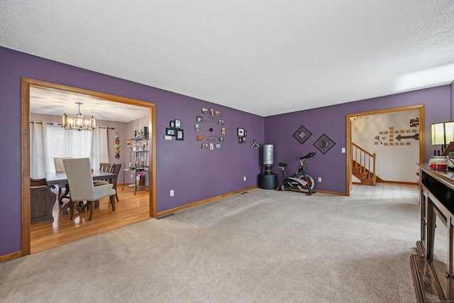 10 Heritage Dr, Prospect, CT 06712 - living room with carpet flooring, a chandelier, and stairway