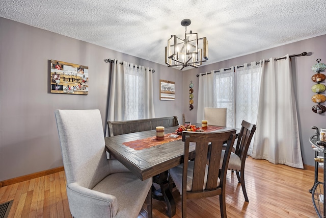 10 Heritage Dr, Prospect, CT 06712 - dining room with a textured ceiling, a chandelier, and light wood finished floors