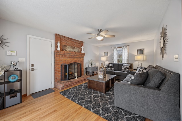 10 Heritage Dr, Prospect, CT 06712 - living area with ceiling fan, light wood-type flooring, and a brick fireplace