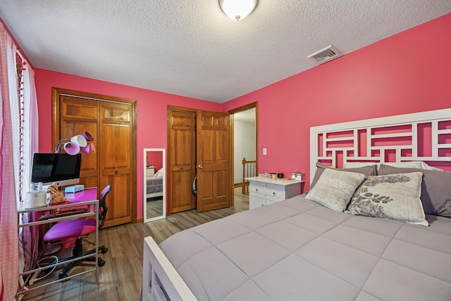 10 Heritage Dr, Prospect, CT 06712 - bedroom with a textured ceiling, wood finished floors, and a closet