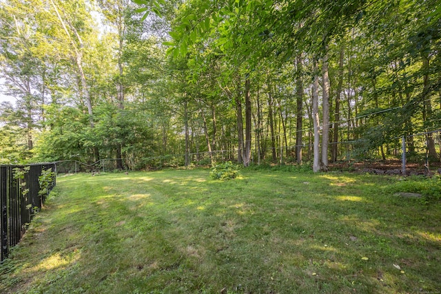 10 Heritage Dr, Prospect, CT 06712 - fenced backyard with a wooded view