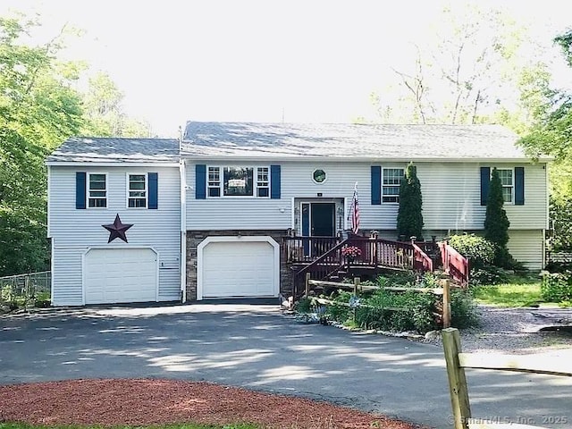 226 Harris Rd, Sterling, CT 06377 - split foyer home with a garage and asphalt driveway