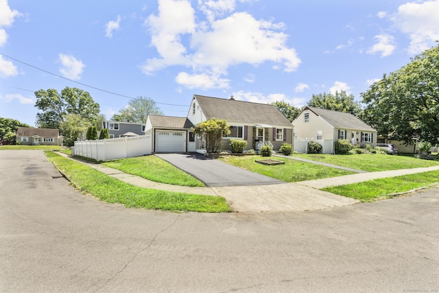 15 Burdette Pl, Milford, CT 06460 - view of front facade with asphalt driveway, an attached garage, and a shingled roof