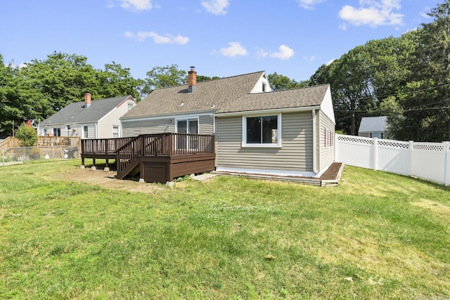 15 Burdette Pl, Milford, CT 06460 - rear view of house with a wooden deck, a fenced backyard, a chimney, and a shingled roof