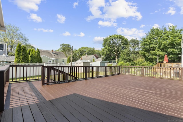 15 Burdette Pl, Milford, CT 06460 - deck featuring view of scattered trees, a residential view, and a playground