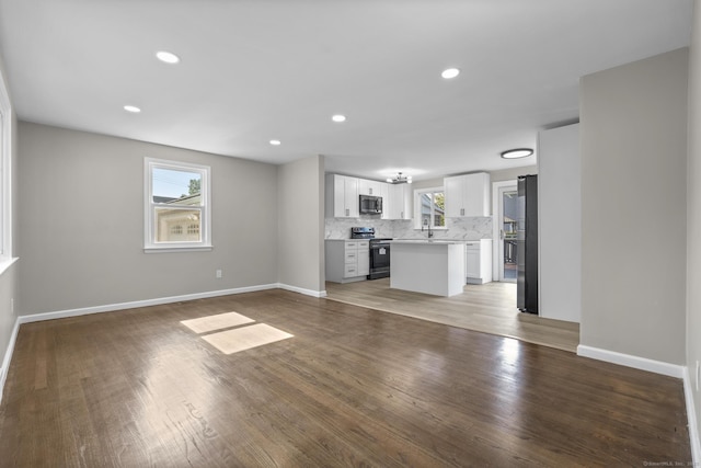 15 Burdette Pl, Milford, CT 06460 - unfurnished living room featuring light wood finished floors and recessed lighting