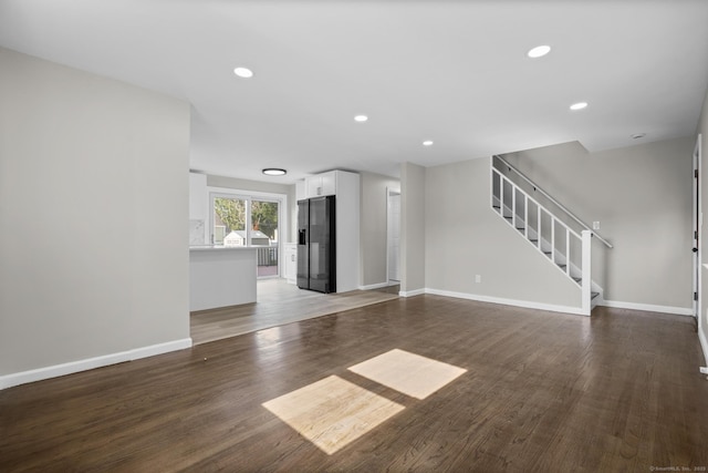 15 Burdette Pl, Milford, CT 06460 - unfurnished living room featuring wood finished floors, stairway, and recessed lighting