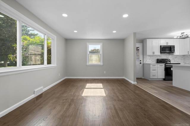 15 Burdette Pl, Milford, CT 06460 - unfurnished living room with dark wood-style floors and recessed lighting