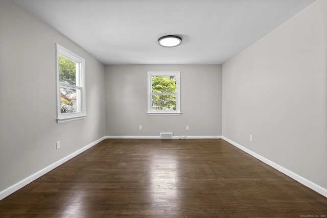 15 Burdette Pl, Milford, CT 06460 - spare room with healthy amount of natural light and dark wood finished floors