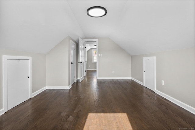 15 Burdette Pl, Milford, CT 06460 - additional living space with lofted ceiling and dark wood-style flooring
