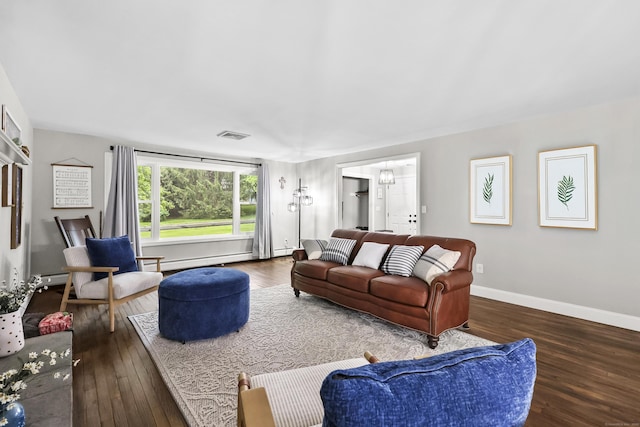 195 Orchard Hill Dr, South Windsor, CT 06074 - living area with hardwood / wood-style floors and a baseboard heating unit