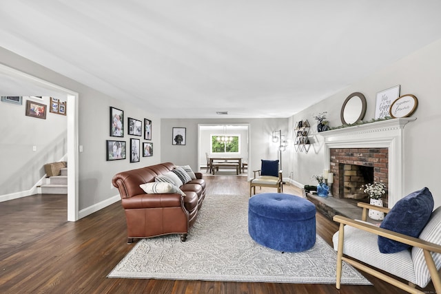 195 Orchard Hill Dr, South Windsor, CT 06074 - living room featuring stairway, wood finished floors, and a brick fireplace