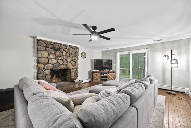 195 Orchard Hill Dr, South Windsor, CT 06074 - living area with a baseboard heating unit, wood-type flooring, ceiling fan, and a fireplace