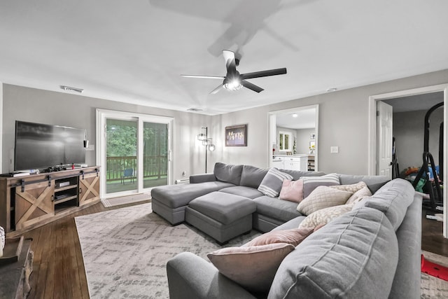 195 Orchard Hill Dr, South Windsor, CT 06074 - living room featuring a ceiling fan and dark wood-type flooring