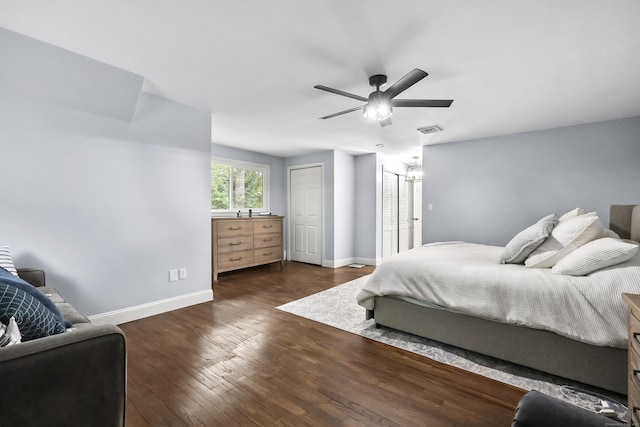 195 Orchard Hill Dr, South Windsor, CT 06074 - bedroom with dark wood-style floors, two closets, and a ceiling fan