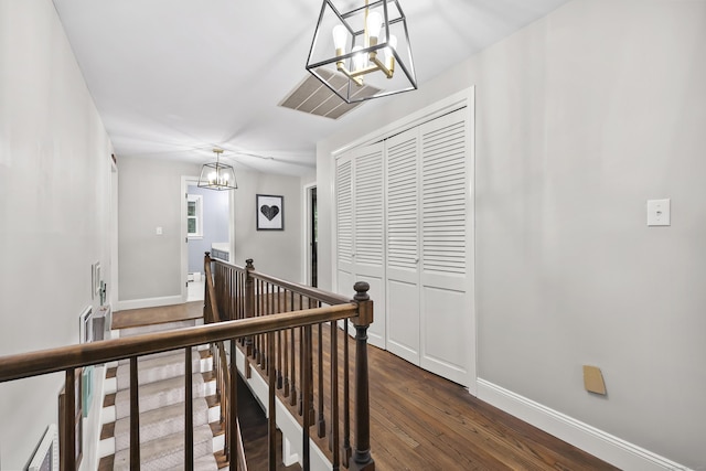 195 Orchard Hill Dr, South Windsor, CT 06074 - hall featuring a chandelier, an upstairs landing, and dark wood finished floors