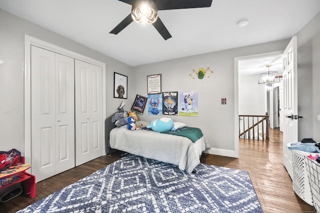 195 Orchard Hill Dr, South Windsor, CT 06074 - bedroom featuring a closet, wood finished floors, ceiling fan, and a chandelier
