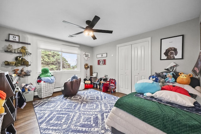 195 Orchard Hill Dr, South Windsor, CT 06074 - bedroom with wood finished floors, a closet, a ceiling fan, and baseboard heating