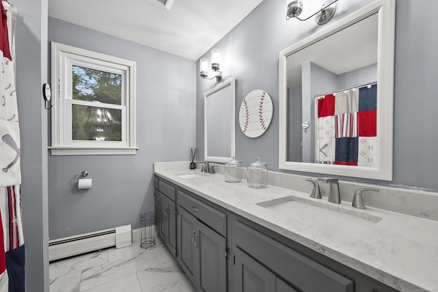 195 Orchard Hill Dr, South Windsor, CT 06074 - full bath featuring a baseboard heating unit, double vanity, and marble finish flooring