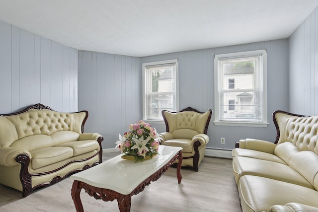 8 3rd St, Norwich, CT 06360 - living area with a baseboard radiator, light wood finished floors, and healthy amount of natural light