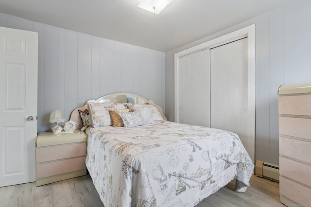 8 3rd St, Norwich, CT 06360 - bedroom featuring a baseboard radiator, wood finished floors, and a closet