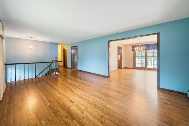 6 Revere Rd, New Milford, CT 06776 - spare room featuring a chandelier and wood finished floors