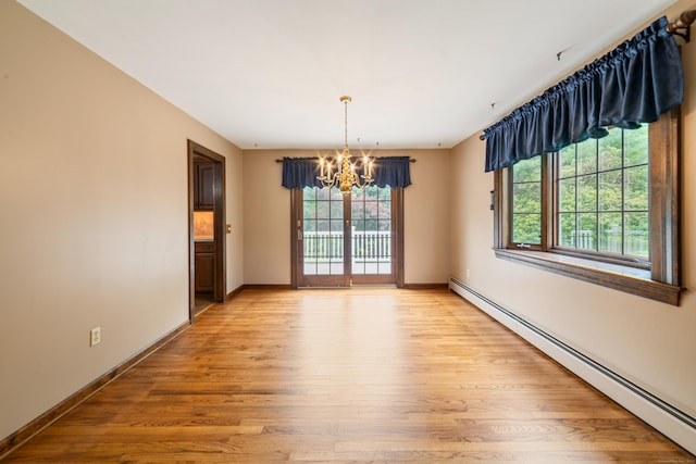 6 Revere Rd, New Milford, CT 06776 - unfurnished room with a baseboard radiator, a chandelier, and light wood-style flooring