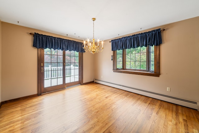6 Revere Rd, New Milford, CT 06776 - empty room with a baseboard heating unit, a chandelier, and wood finished floors