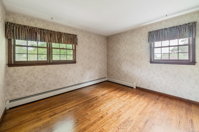 6 Revere Rd, New Milford, CT 06776 - empty room featuring plenty of natural light, wood finished floors, and a baseboard radiator