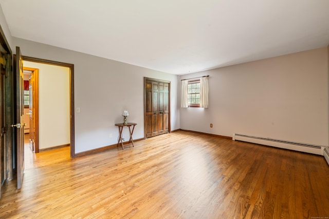 6 Revere Rd, New Milford, CT 06776 - empty room with light wood-style flooring and baseboard heating