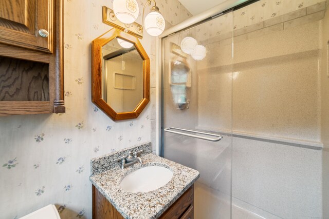 6 Revere Rd, New Milford, CT 06776 - full bathroom with wallpapered walls, vanity, and an enclosed shower
