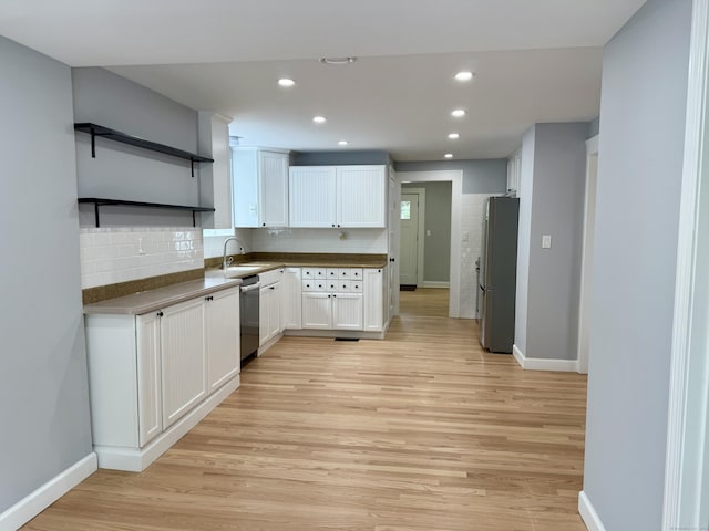 654 Nichols Ave, Stratford, CT 06614 - kitchen featuring appliances with stainless steel finishes, open shelves, light wood-style flooring, white cabinets, and recessed lighting
